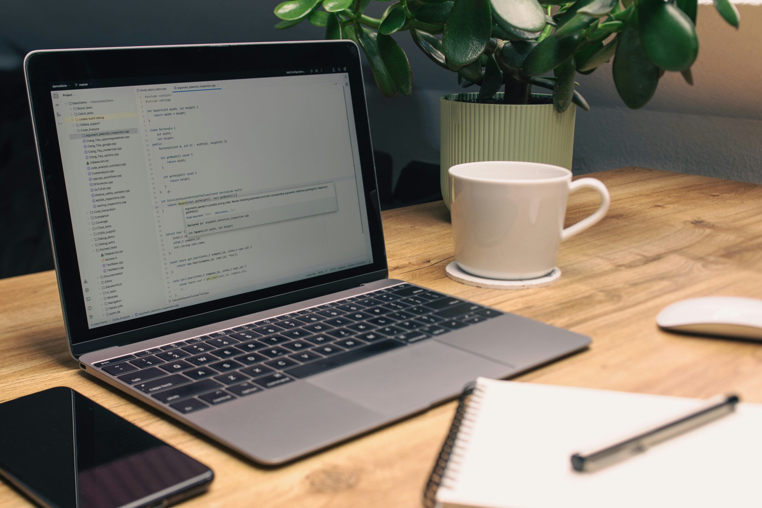 Technical workspace with laptop and notes representing responsible AI use in SQL Server consulting