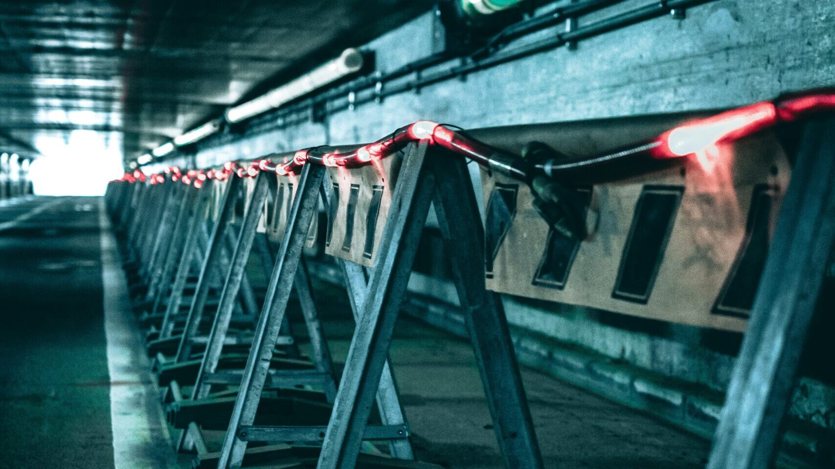 Industrial barriers in a technical tunnel representing a SQL Server blocking chain and head blocker.